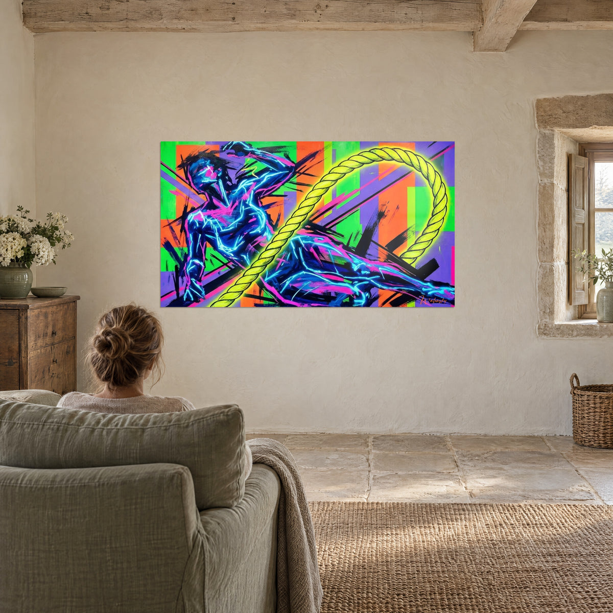 Tableau homme aux muscles tracés en cyan fluo, corde jaune acide, fond orange, vert et violet, face à une personne assise dans un fauteuil