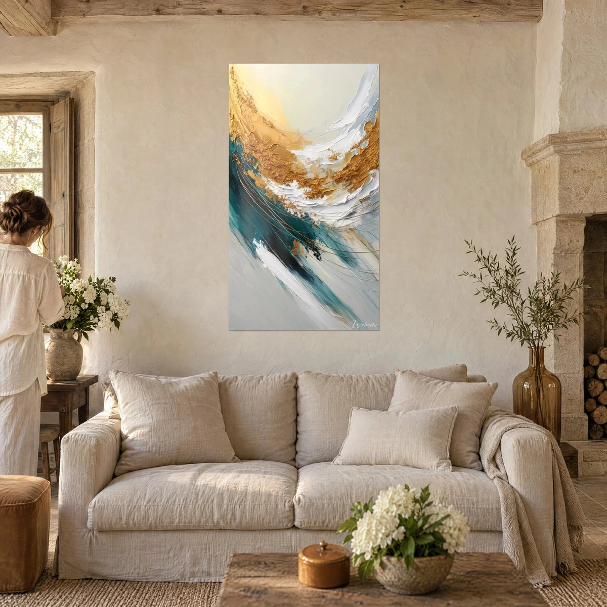 Wall art of a wavy gold and foam, painted with a palette knife in duck blue and white, above a sofa in a bright living room