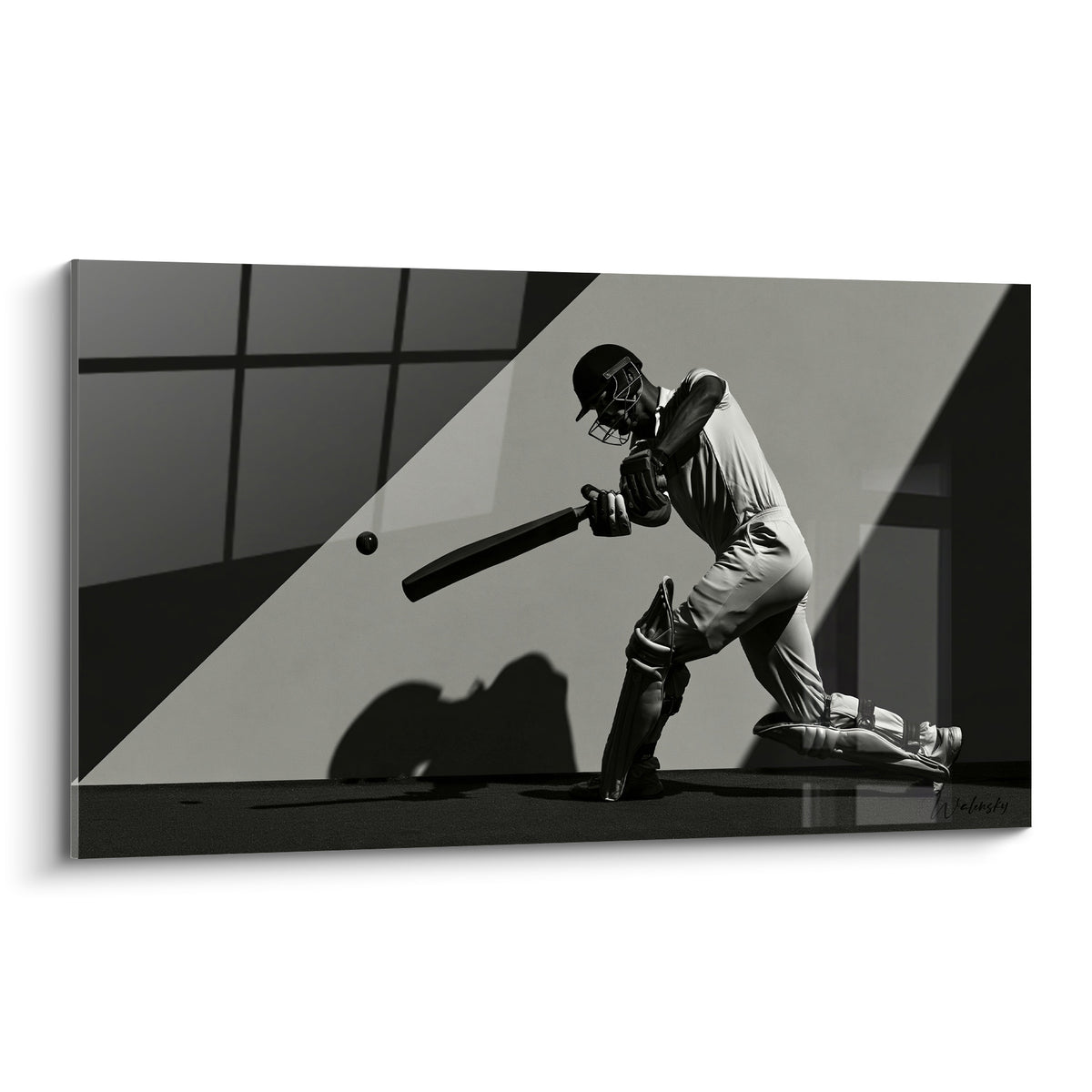 Batteur de cricket en gris anthracite et blanc, geste figé sous une lumière diagonale intense