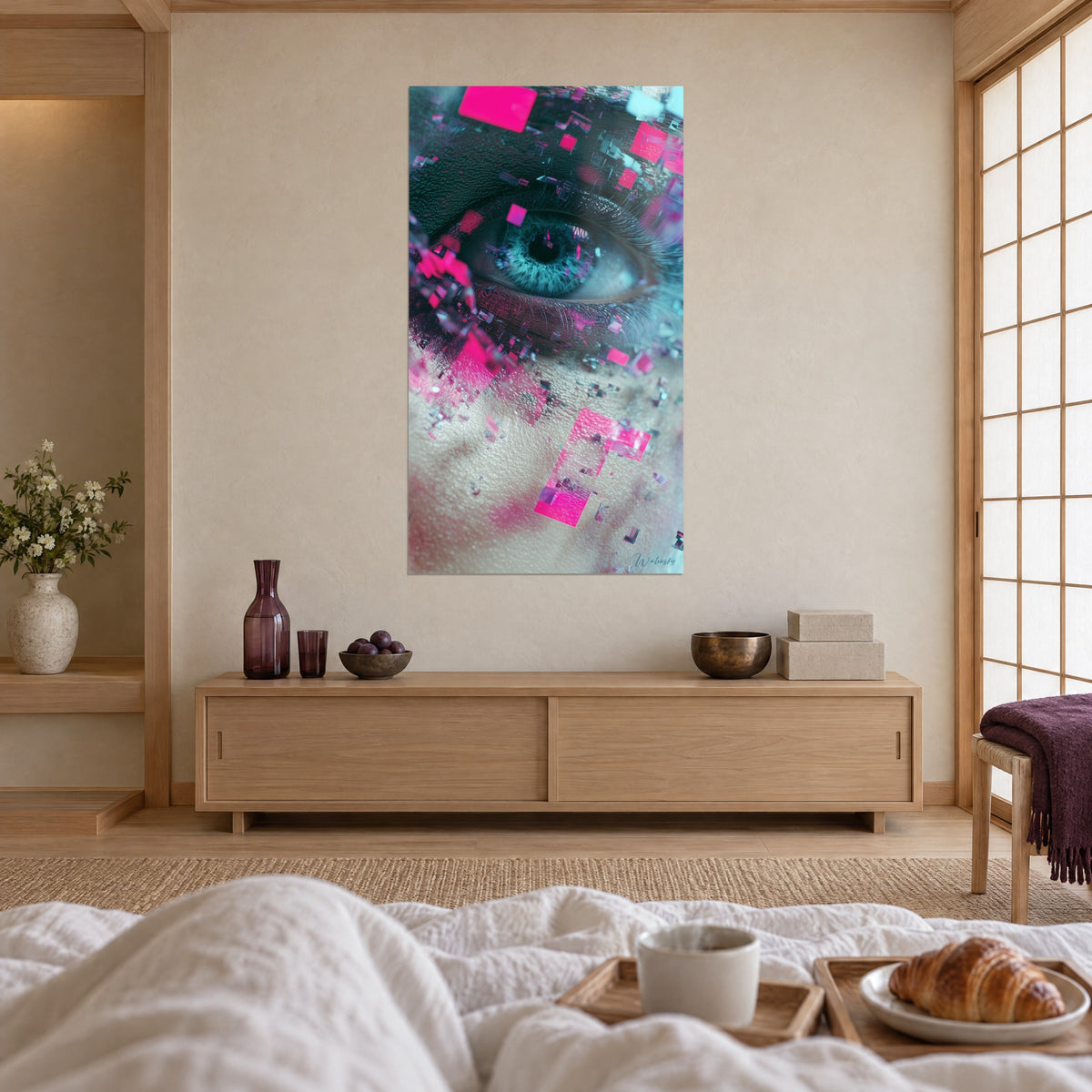 Schilderij zwarte pupil omringd door een turquoise iris en roze fragmenten, tegenover een wit dekbed, boven een bed in een lichte slaapkamer