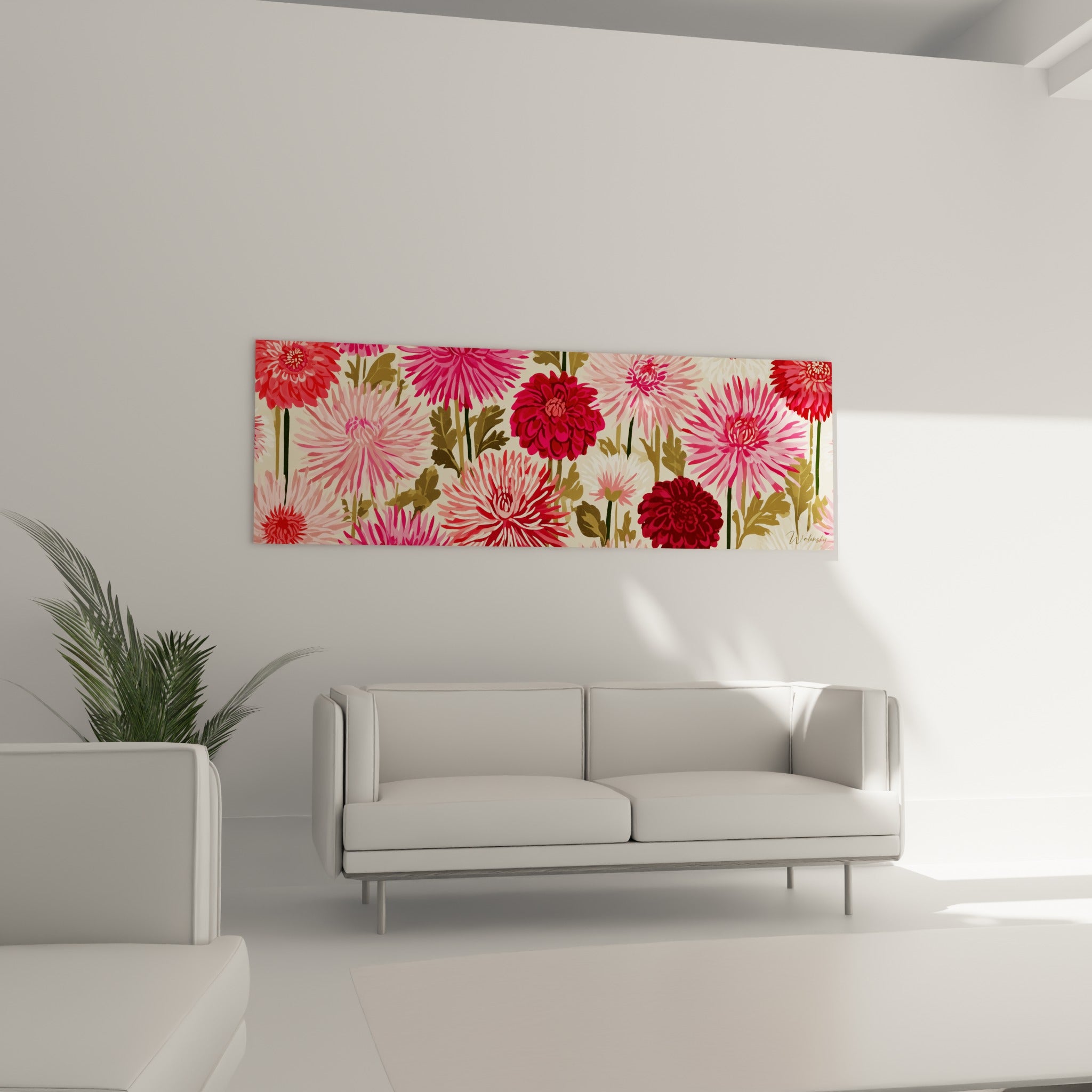 Corolles de dahlia rose fuchsia et vert olive placées au-dessus d'un canapé dans un salon lumineux