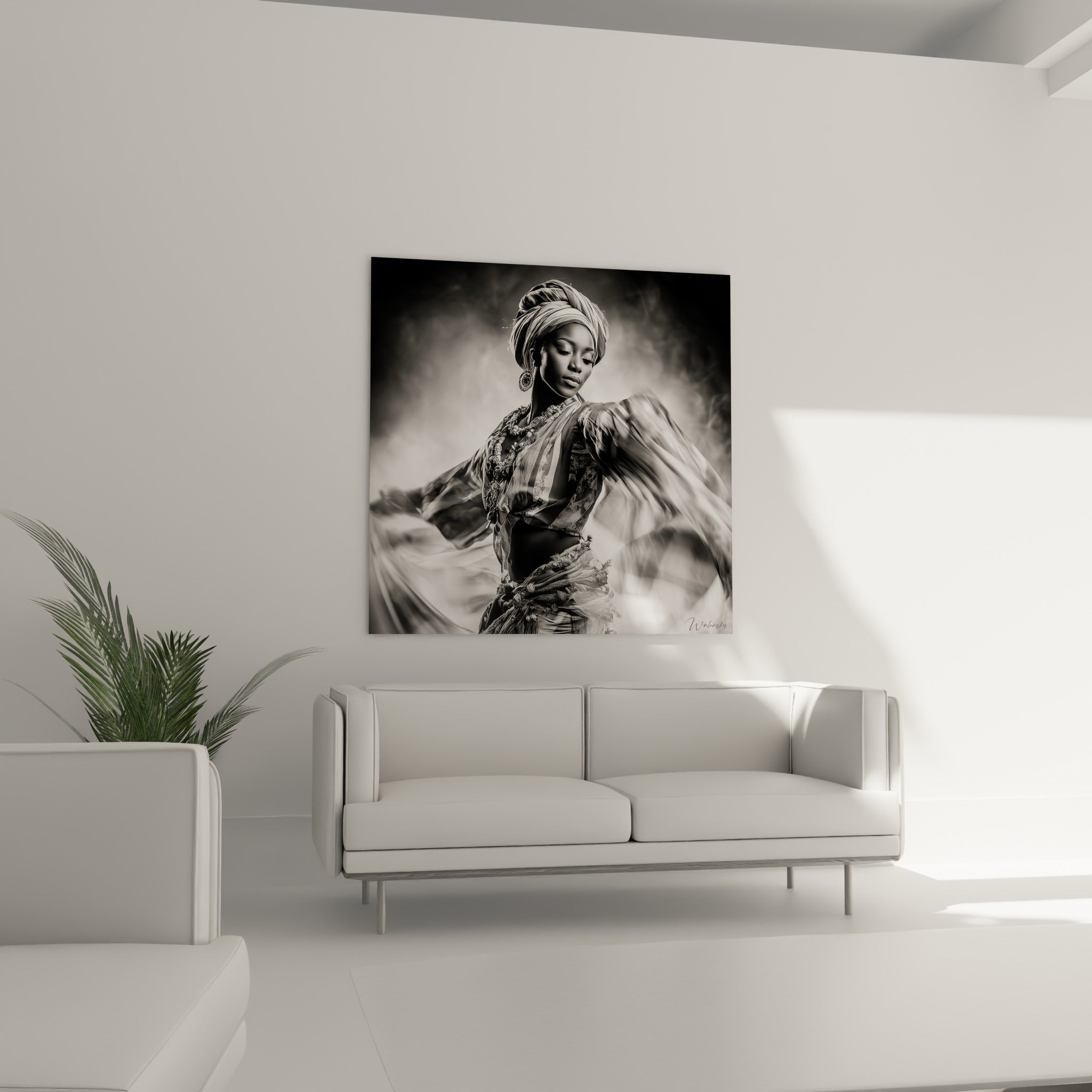 Tourbillon de tissu blanc et noir profond, geste de danse figé, au-dessus d'un canapé dans un salon lumineux