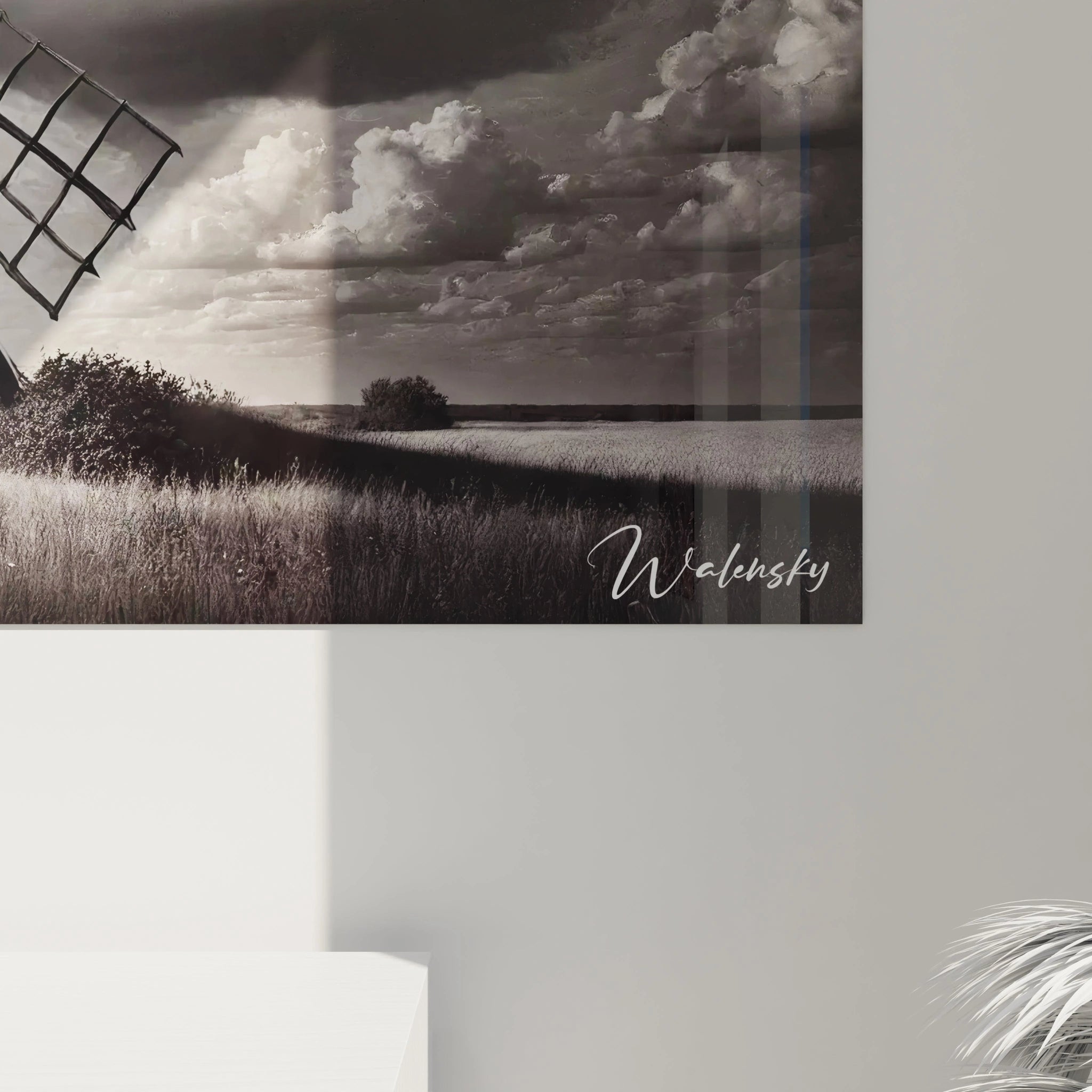 Vue rapprochee d’un tableau noir et blanc detaille avec des pales de moulin et des nuances intenses de gris et blanc evoquant nostalgie et force.