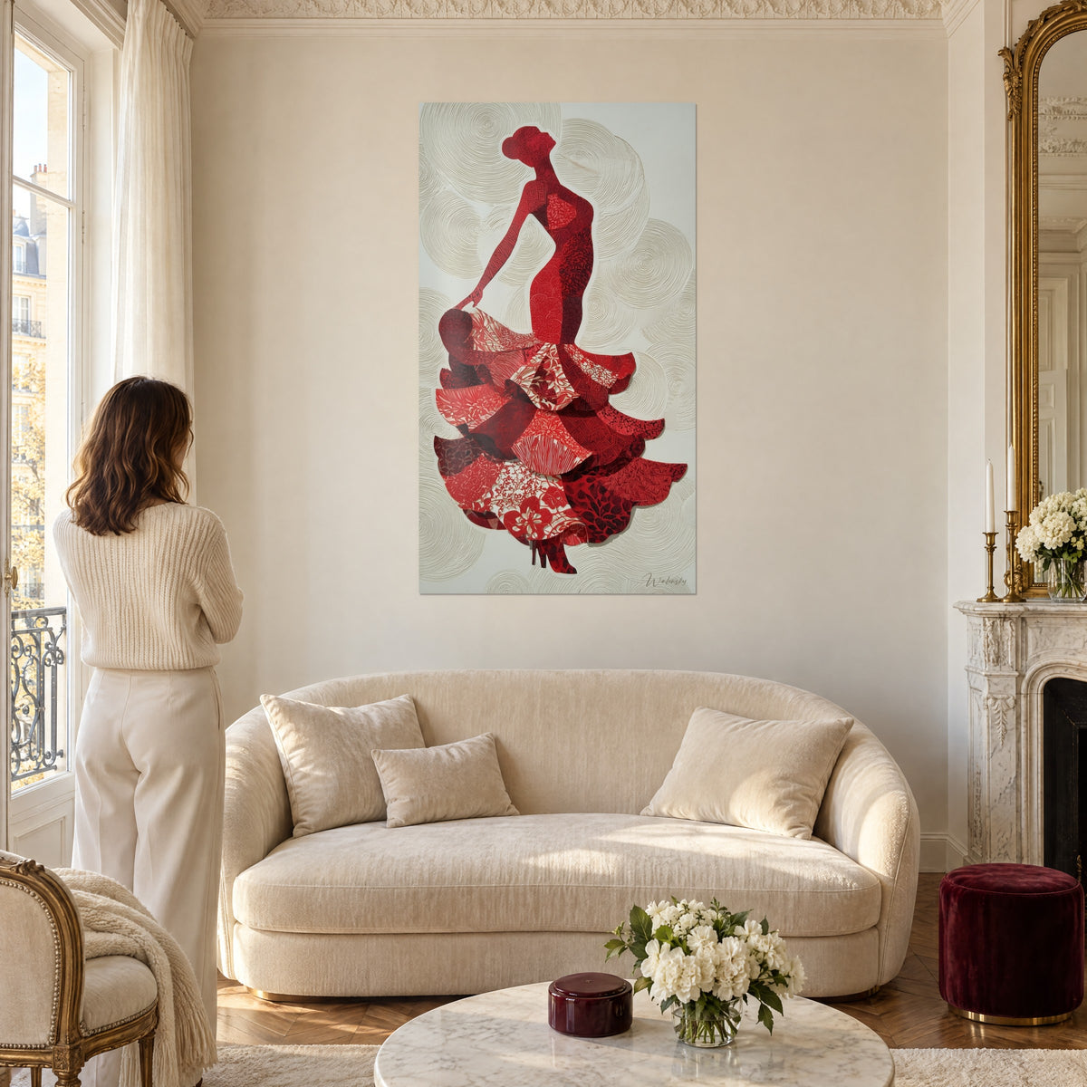 Wall art of a Spanish dancer in a carmine red dress with floral ruffles on an ivory background, above a sofa in a bright living room