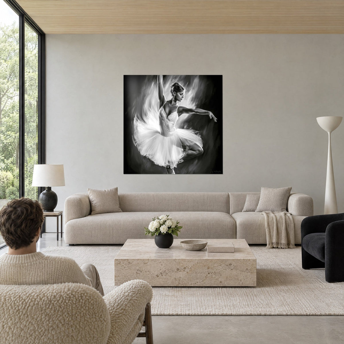 Tableau ballerine en tutu blanc virevoltant, bras levé, fond noir charbon et gris perle, au-dessus d'un canapé dans un salon lumineux