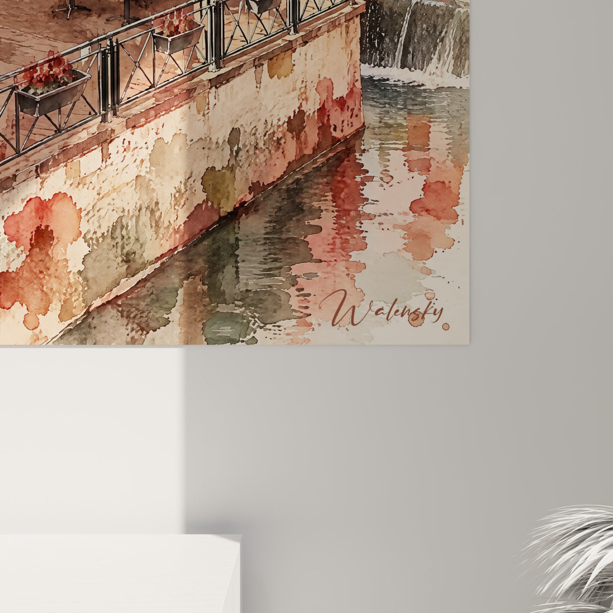 Détail des éclaboussures aquarelle roses et ocre se mêlant aux toitures orangées et reflets de rivière