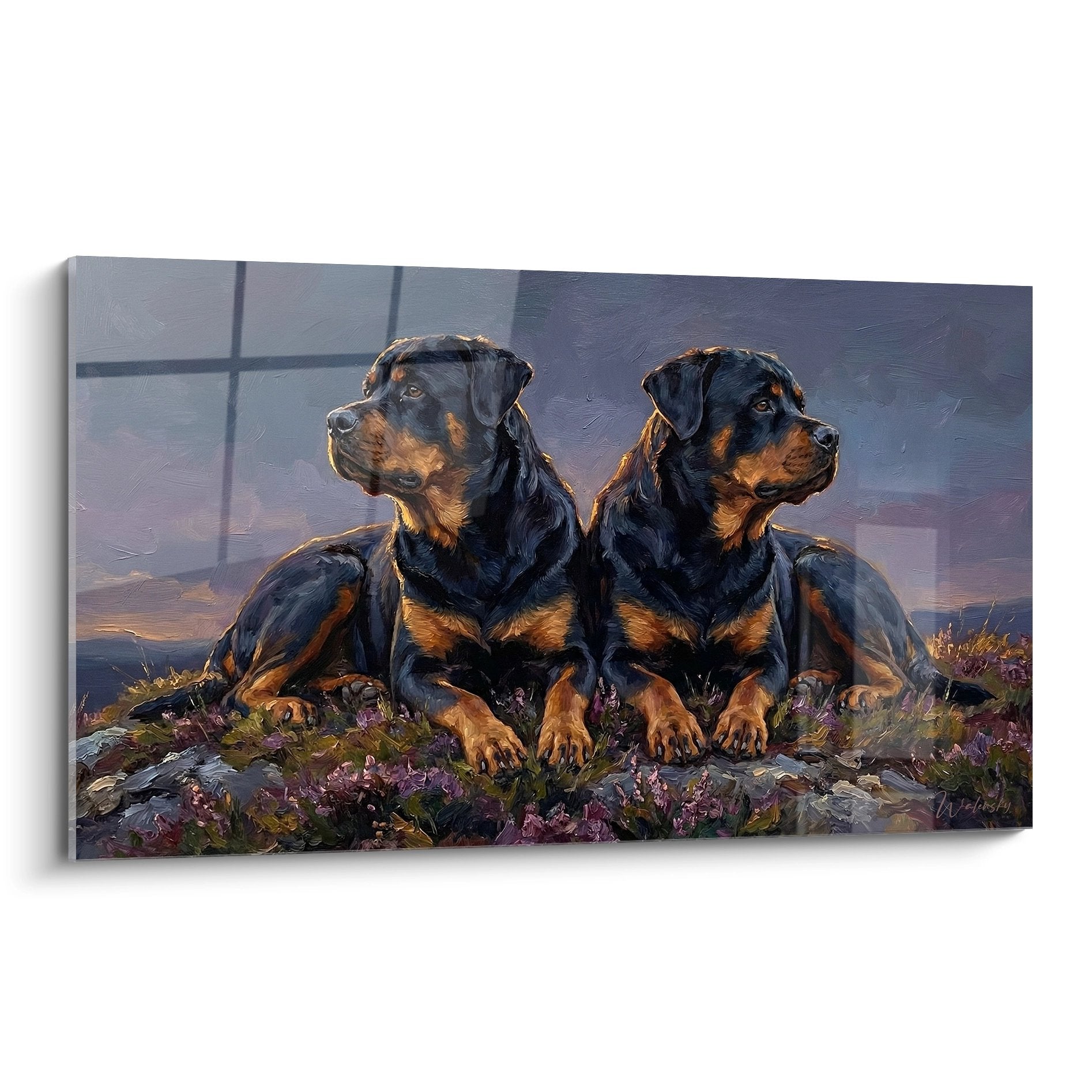 Tableau de deux rottweilers allongés côte à côte dans un paysage de bruyères au coucher du soleil