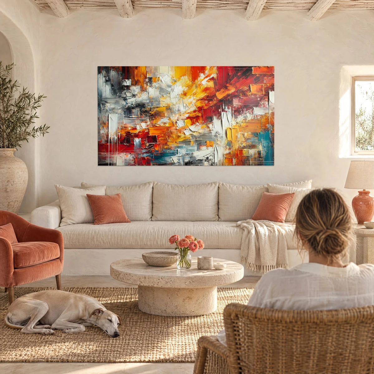 Wall art abstract with thick brushstrokes in vivid red and sunny yellow, white palette-knife accents, above a sofa in a bright living room