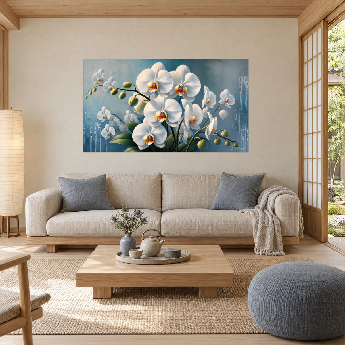 Wall art white phalaenopsis orchids with orange hearts on a frosty blue background, above a sofa in a bright living room