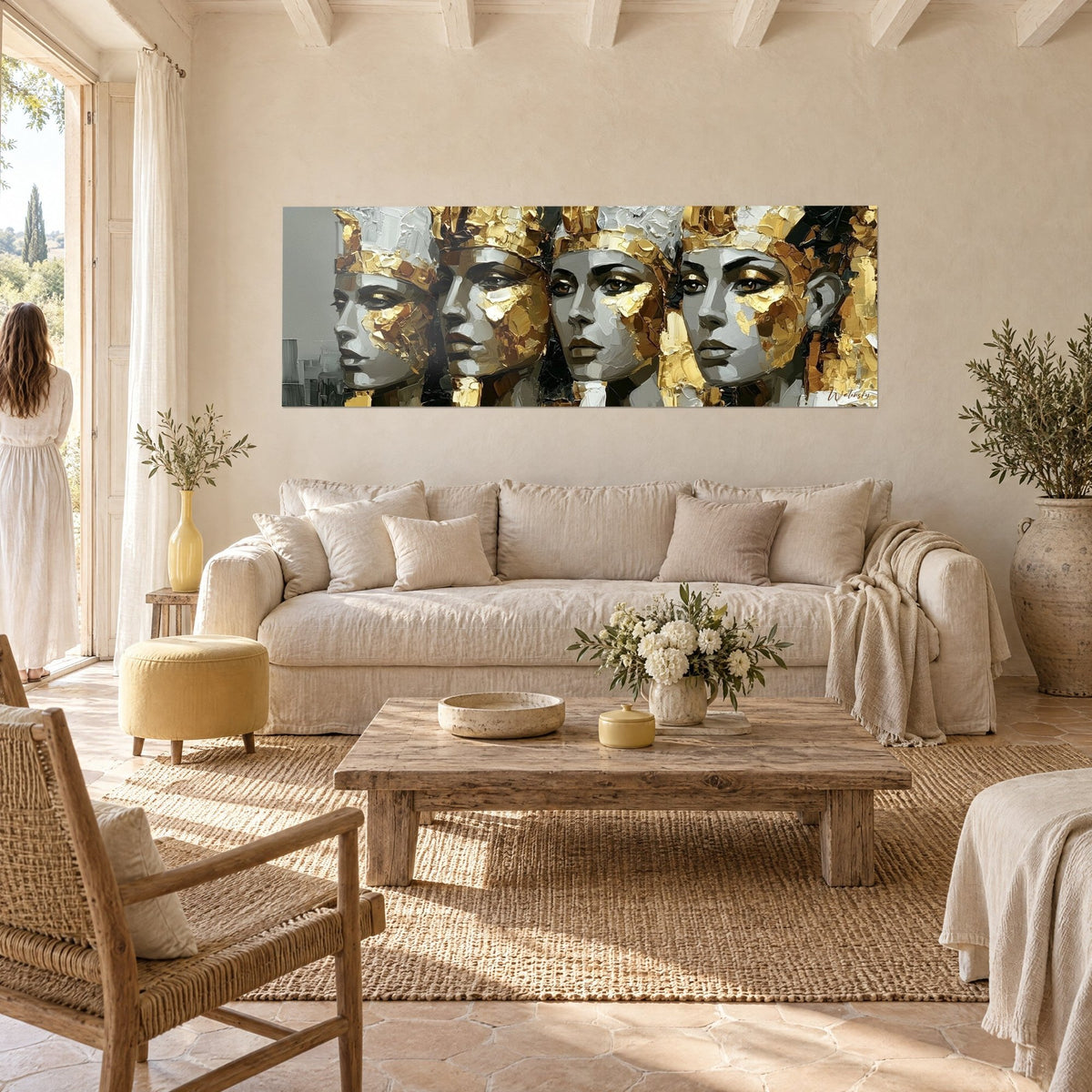 Wall art four Egyptian queens in gold and grey, palette-knife raised crowns, above a sofa in a bright living room