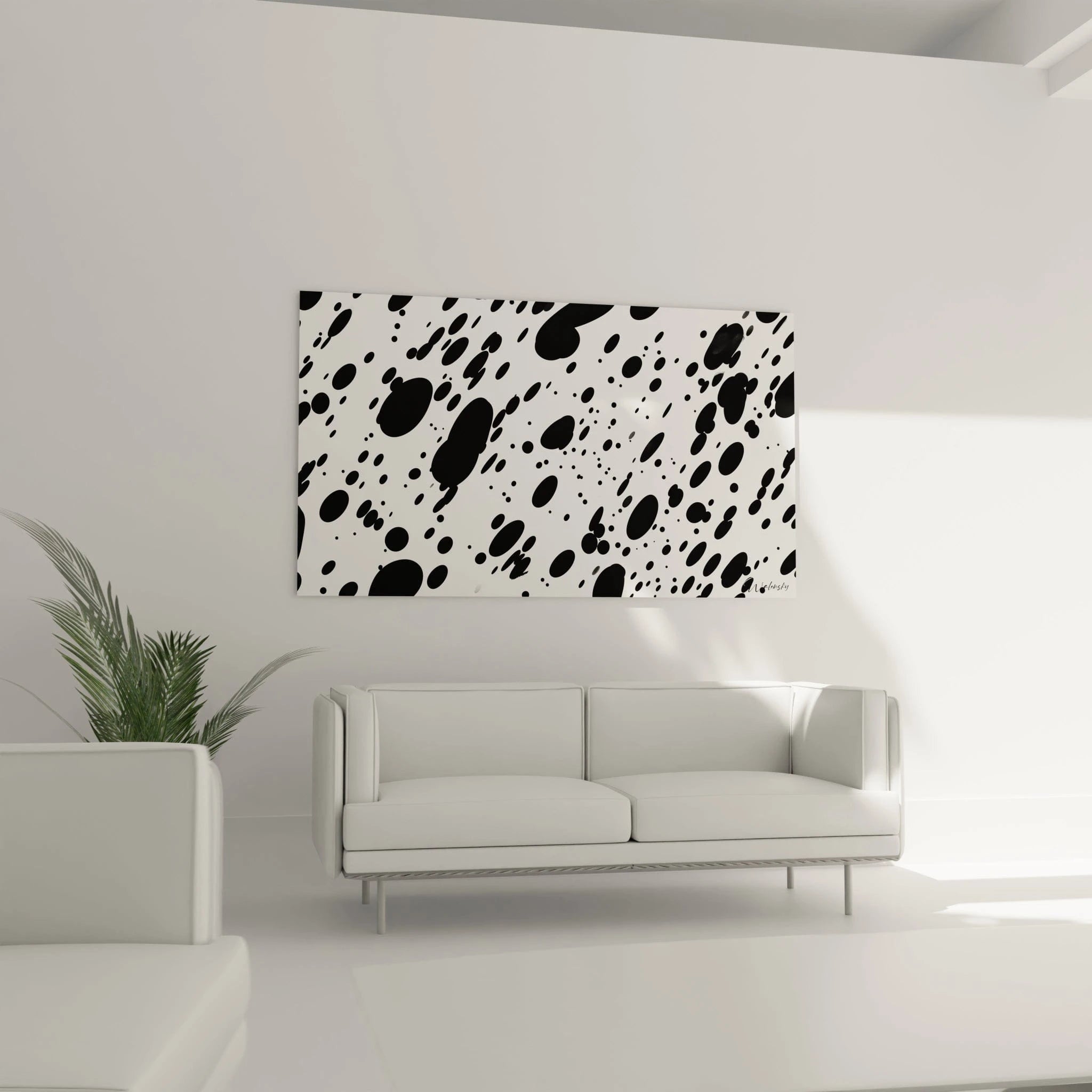 Tableau tacheté noir et blanc Walensky accroché dans un salon moderne avec un canapé blanc