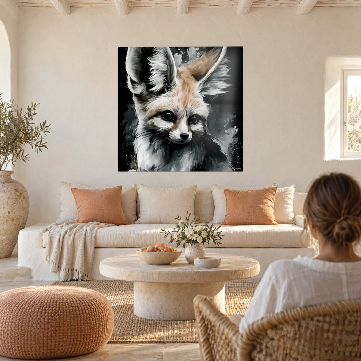 Wall art desert fox with huge beige and white ears on black background, dark gaze, above a sofa in a bright living room
