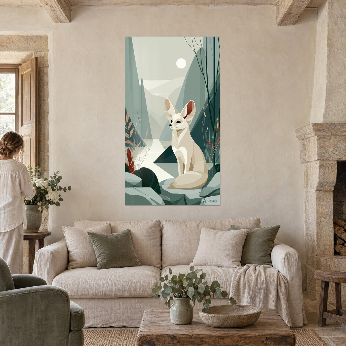 Wall art fennec fox with large cream and red-brown ears, white moon over sage green mountains, above a sofa in a bright living room