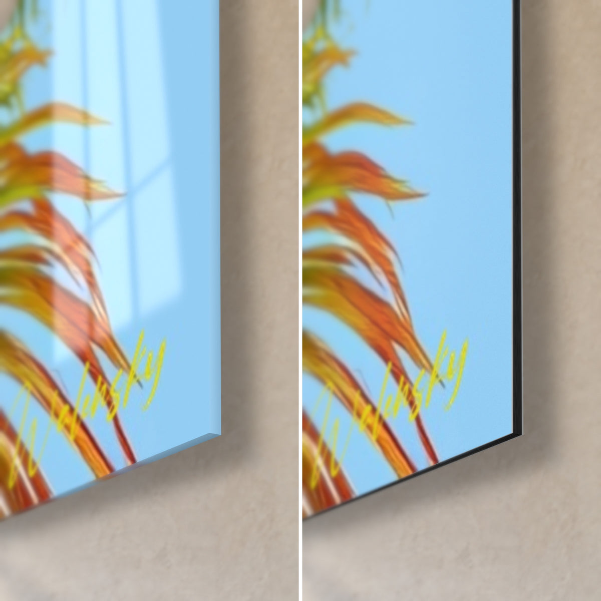 Tropical palm frond wall art with orange highlights on a sky-blue background, bottom right corner: glossy glass on the left, matte Dibond on the right