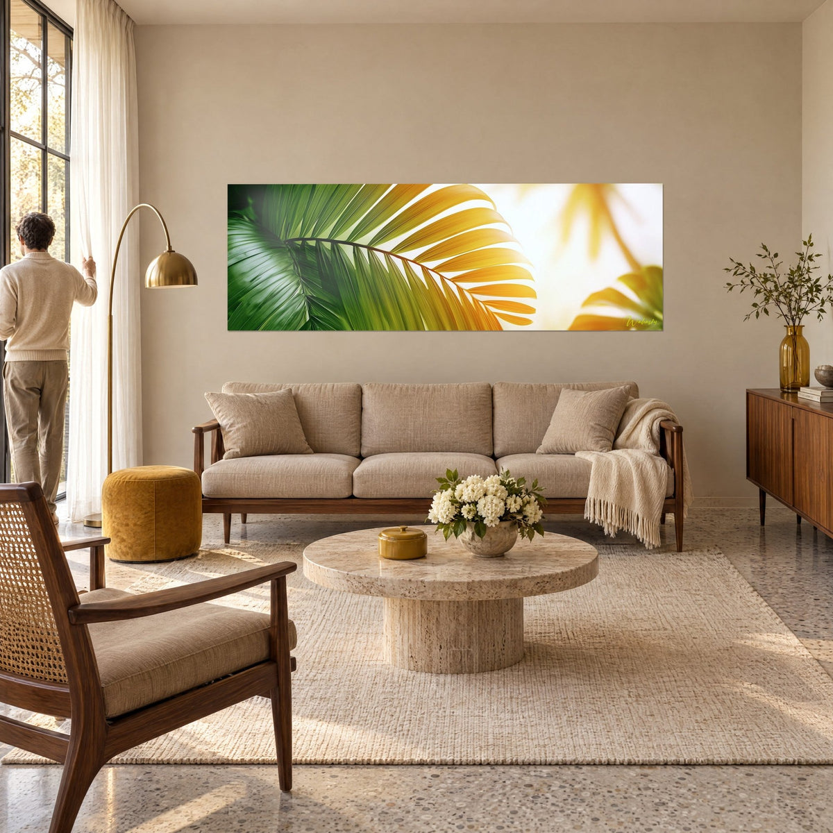 Wall art palm frond in emerald green fading to gold, backlit veins, above a sofa in a bright living room