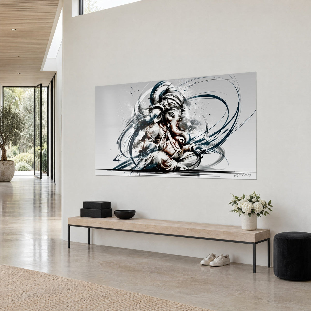 Wall art of Ganesh seated in lotus pose, folded trunk, calligraphic strokes in midnight blue and grey splashes, on a cream wall, three-quarter view