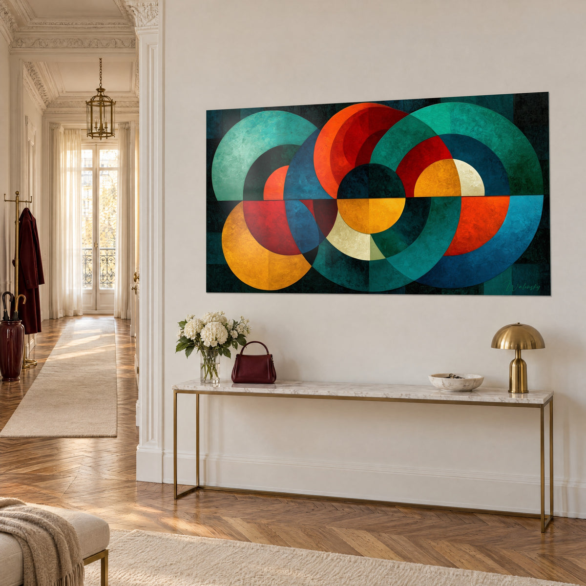 Wall art with an orange and petrol blue disc geometric composition, three-quarter view, above a gilded Haussmann-style console