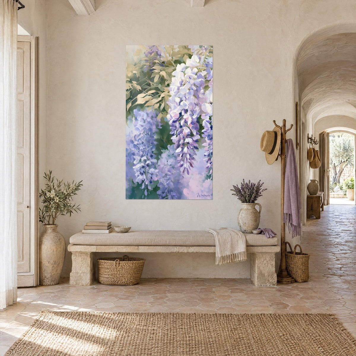Wall art hanging clusters in mauve and cream, sand-coloured leaves, in a vaulted stone corridor with terracotta tiles of a Provençal farmhouse
