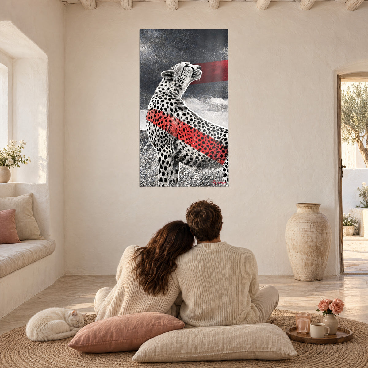 Wall art large feline in profile, muzzle raised, red band on slate and white background, couple seen from behind seated on cushions, cat