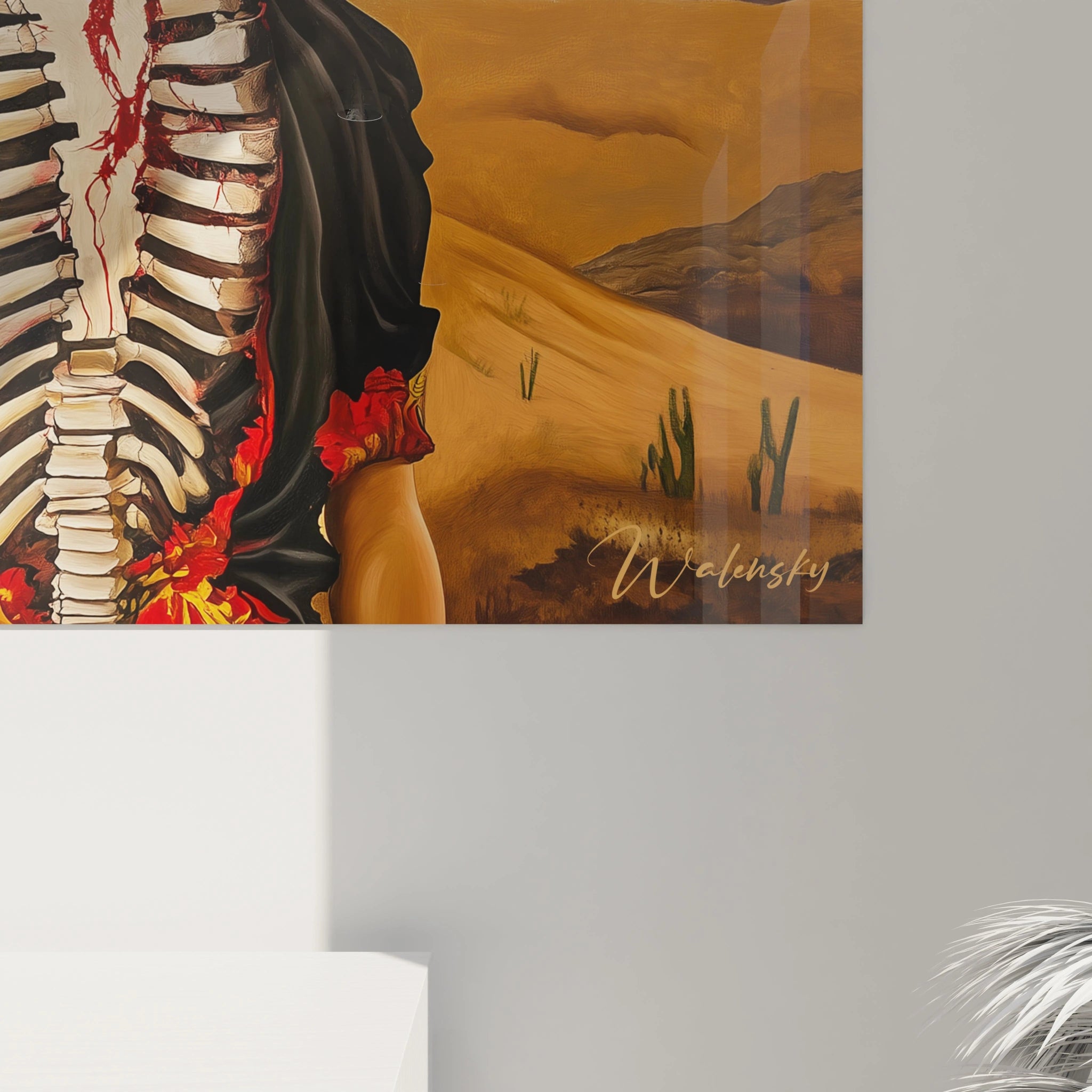 Un tableau Frida Kahlo centré sur une silhouette féminine, avec des éléments anatomiques peints en contraste rouge et blanc, sur un fond naturel composé de montagnes marron et d’un ciel bleu vif.