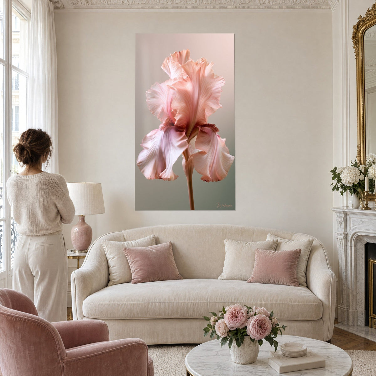 Wall art powdery pink iris with wavy petals, grey-green background, above a sofa in a bright living room