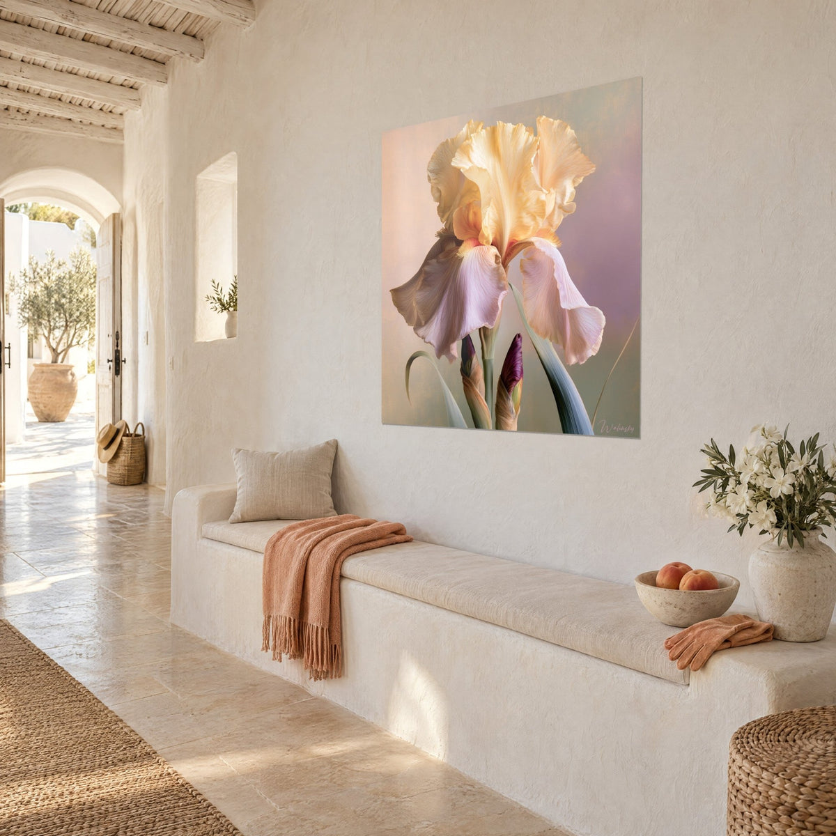 Wall art yellow iris in butter and lilac tones, fuzzy orange beard, hung on a white wall above a stone bench