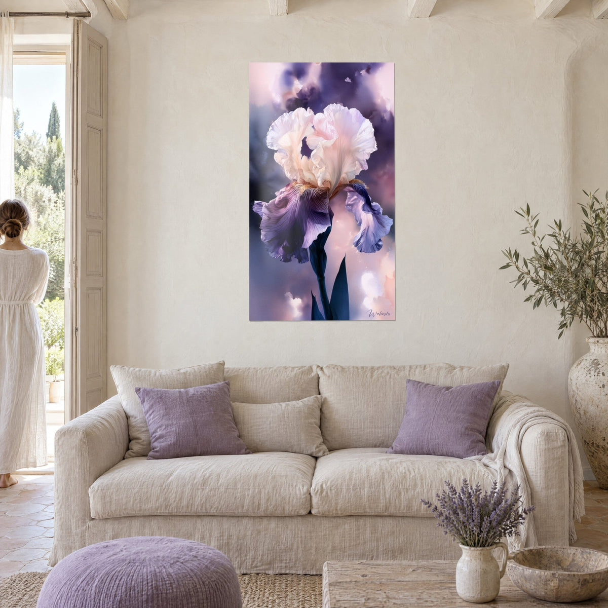 Wall art bearded iris with ivory and violet petals, misty pink background, above a sofa in a bright living room