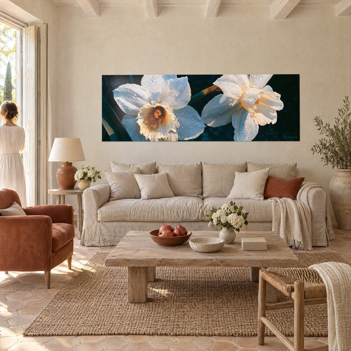 Wall art white daffodils pearled with dew, orange heart on a midnight blue background, above a sofa in a bright living room