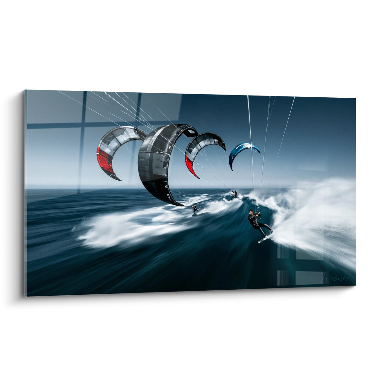 Kitesurfeurs alignés sur vague bleu marine, voiles anthracite et rouges déployées