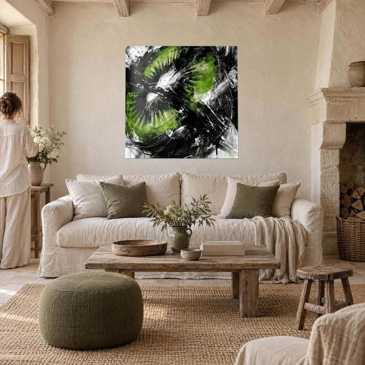 Wall art kiwi cut in half, acid green and jet black flesh, white splashes, above a sofa in a bright living room