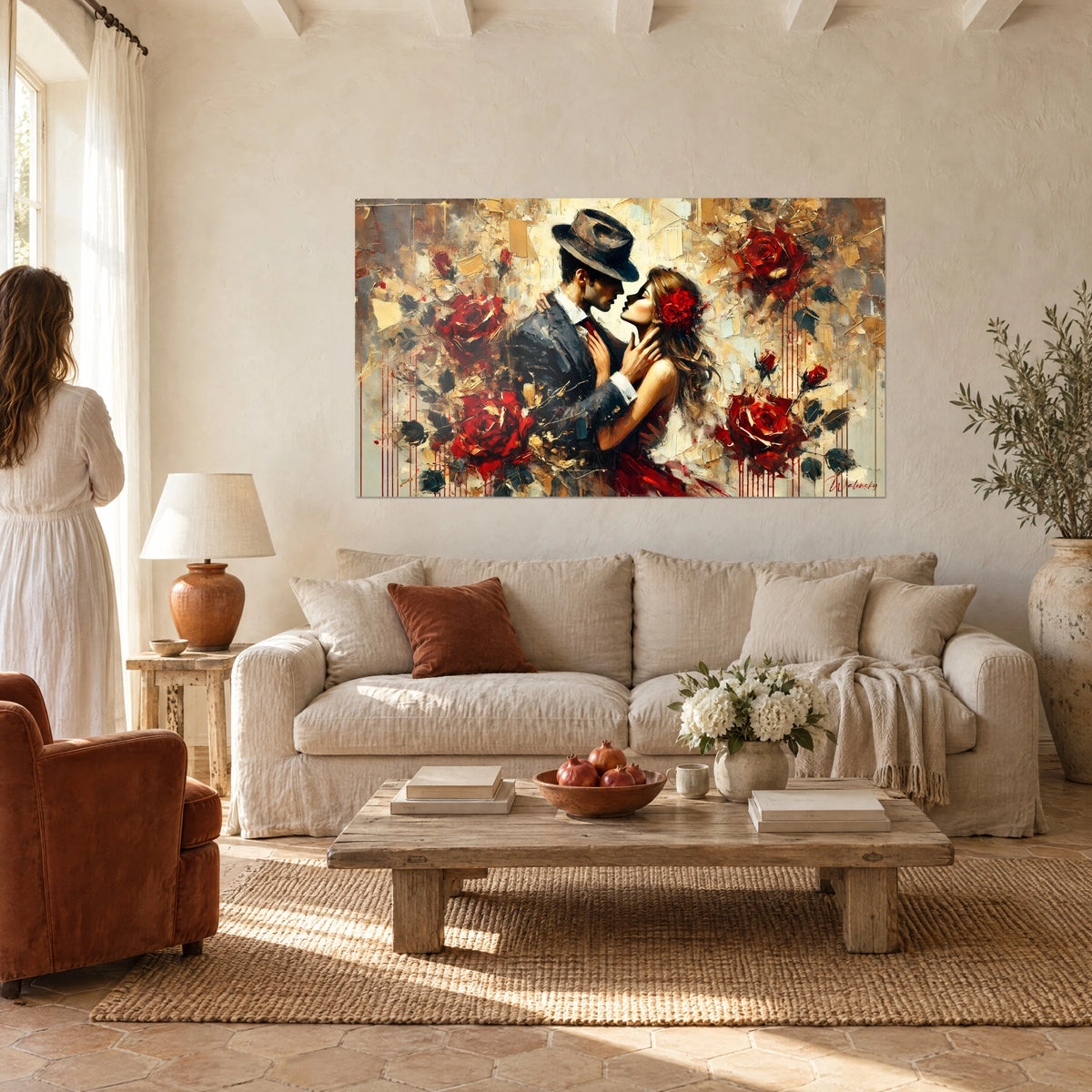 Wall art dancing couple against red roses, man in a grey felt hat and carmine dress, above a sofa in a bright living room