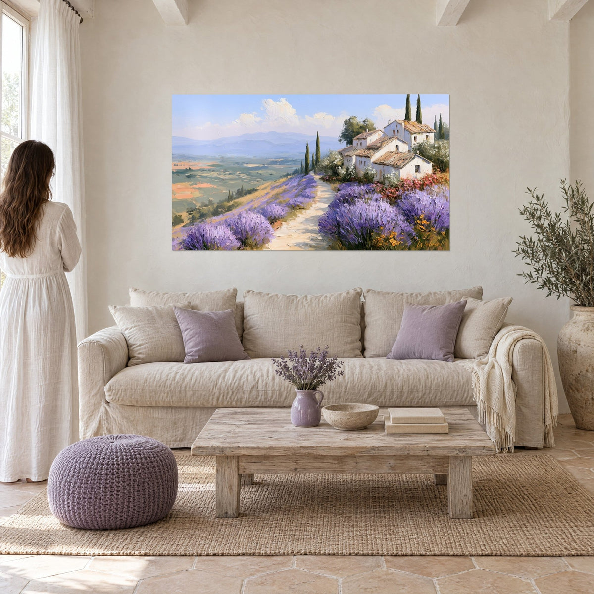 Wall art Provençal hamlet with terracotta roofs overlooking a cream path and purple lavender fields, above a sofa in a bright living room