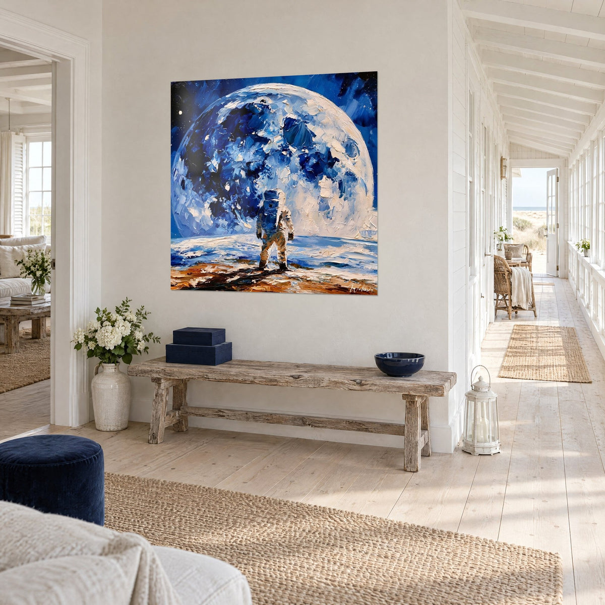 Wall art cosmonaut in a white suit on an ochre floor, large cobalt blue moon sphere, hallway of a seaside house