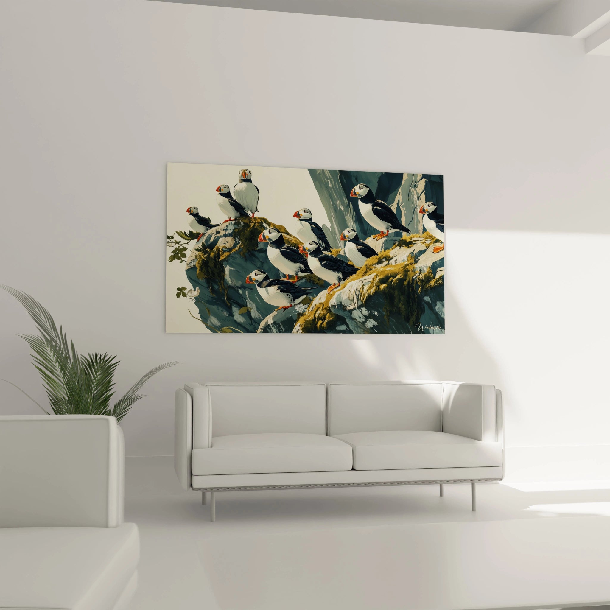 Tableau macareux Walensky accroché au mur dans un salon moderne avec canapé blanc et plante verte