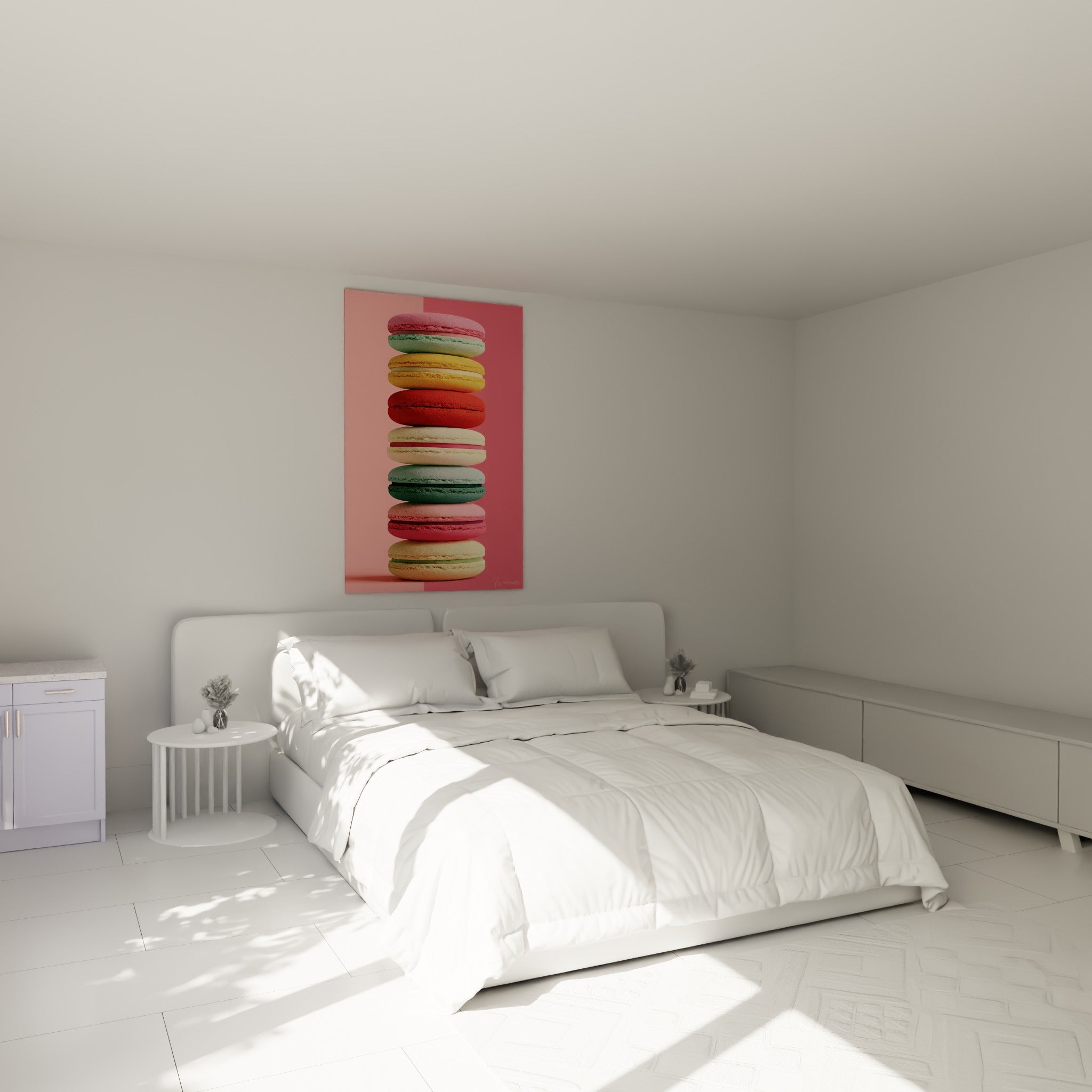 Empilement de macarons rose poudré et vert sauge au-dessus d'un lit dans une chambre claire