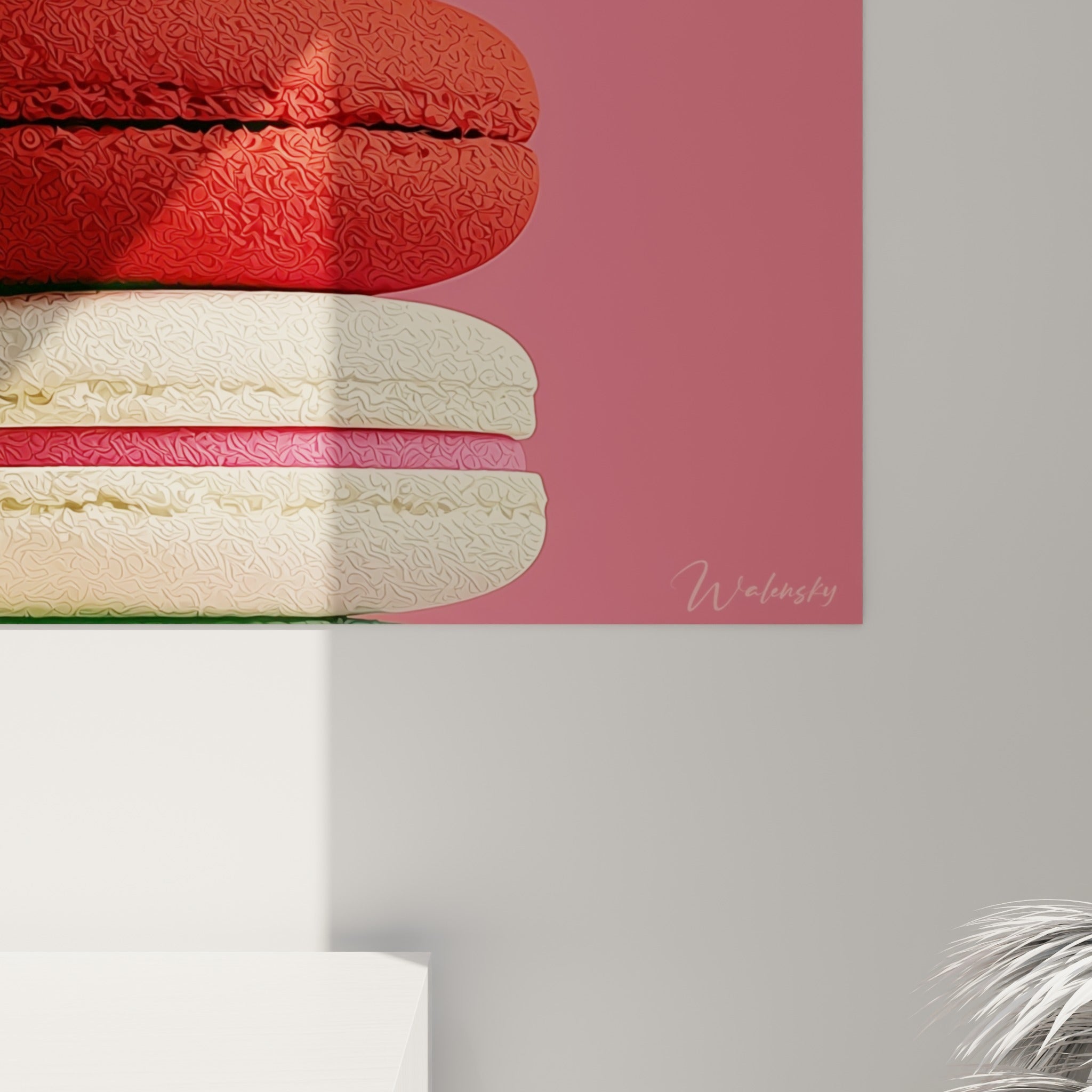 Empâtements colorés entre rose poudré et rouge terracotta visibles en gros plan sur la pile de macarons