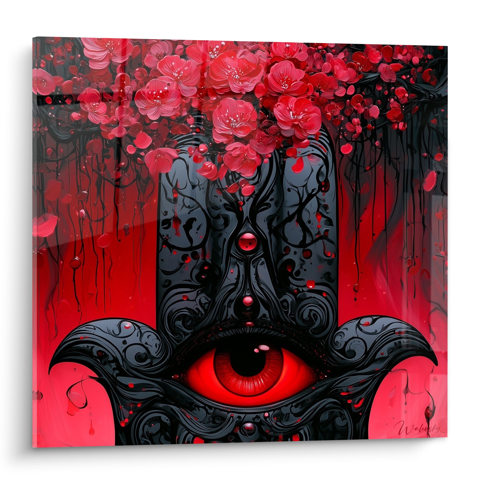 Main de fatma noire sculptée à l'œil rouge, fleurs rose et rouge tombant du sommet