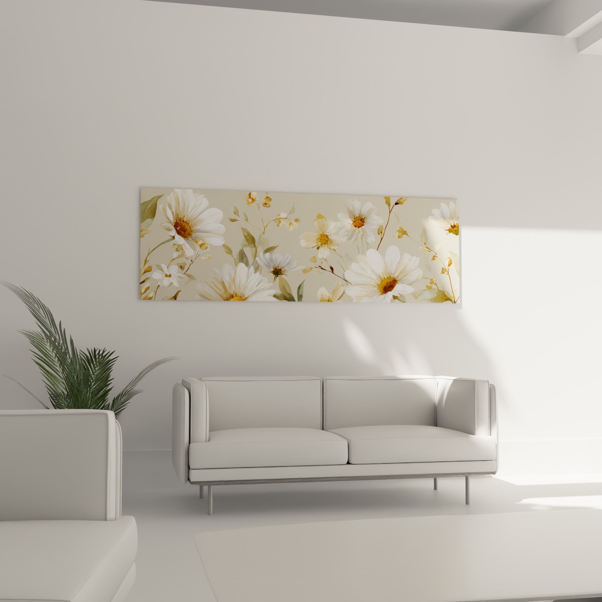 Fleurs de marguerite blanches et feuillages vert sauge disposés au-dessus d'un canapé dans un salon lumineux