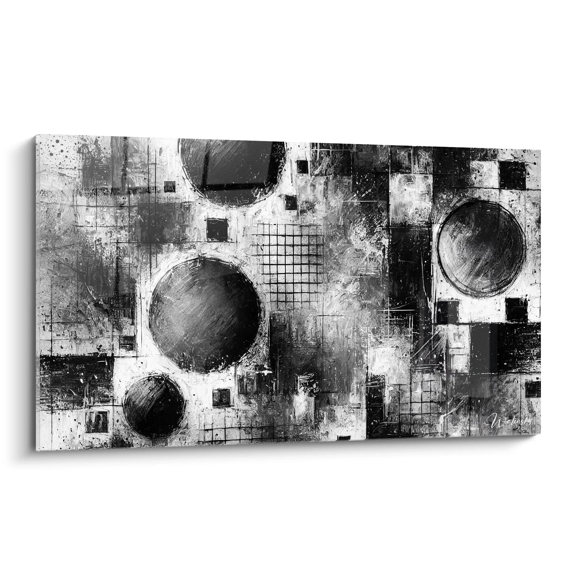 Présentation du tableau "Mécanique du Chaos", une œuvre abstraite en noir et blanc. Vue de biais, révélant ses formes géométriques et ses textures contrastées. Équilibre entre ordre et chaos.