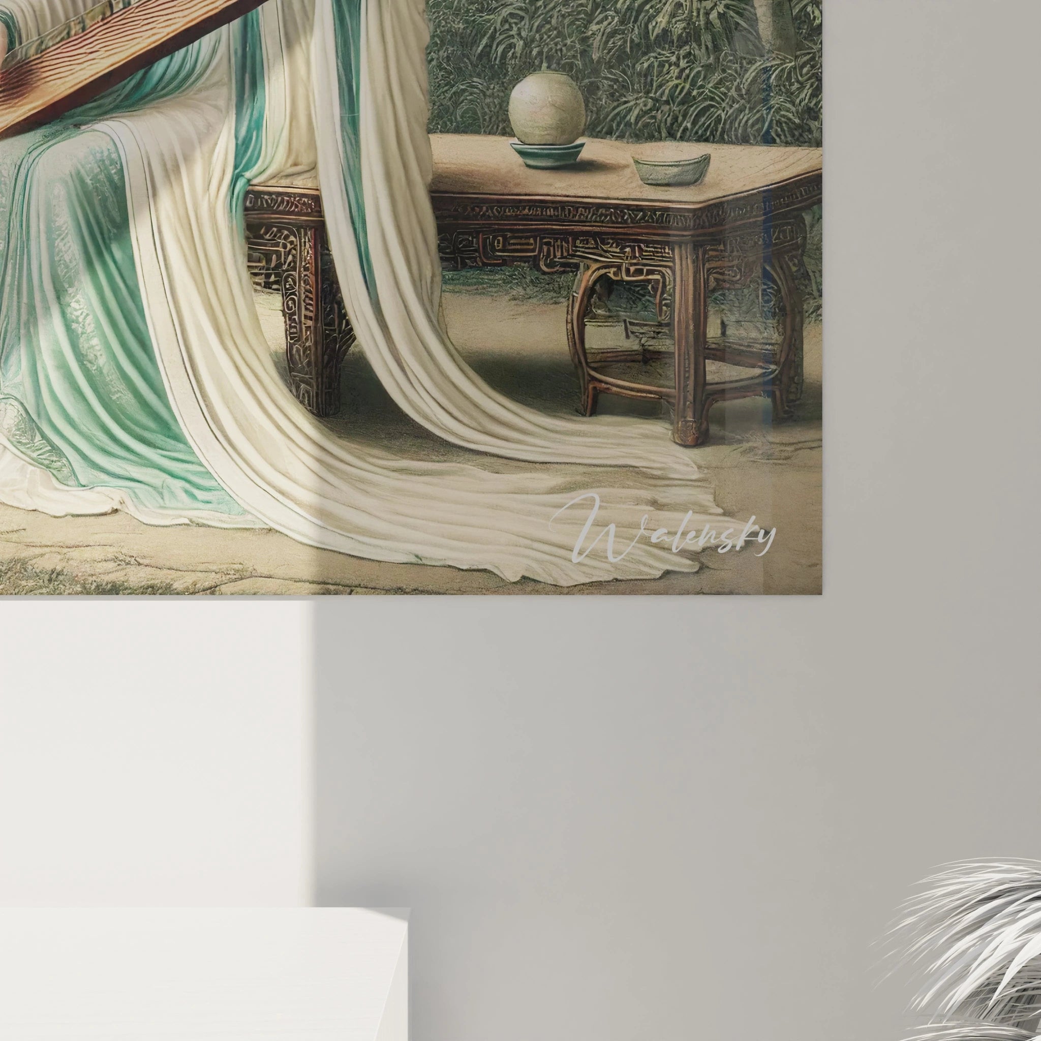 Vue rapprochee d'un tableau traditionnel asiatique riche en details. Les tons verts et beiges et la representation d'une scene ancienne invitent a la meditation et a la contemplation.