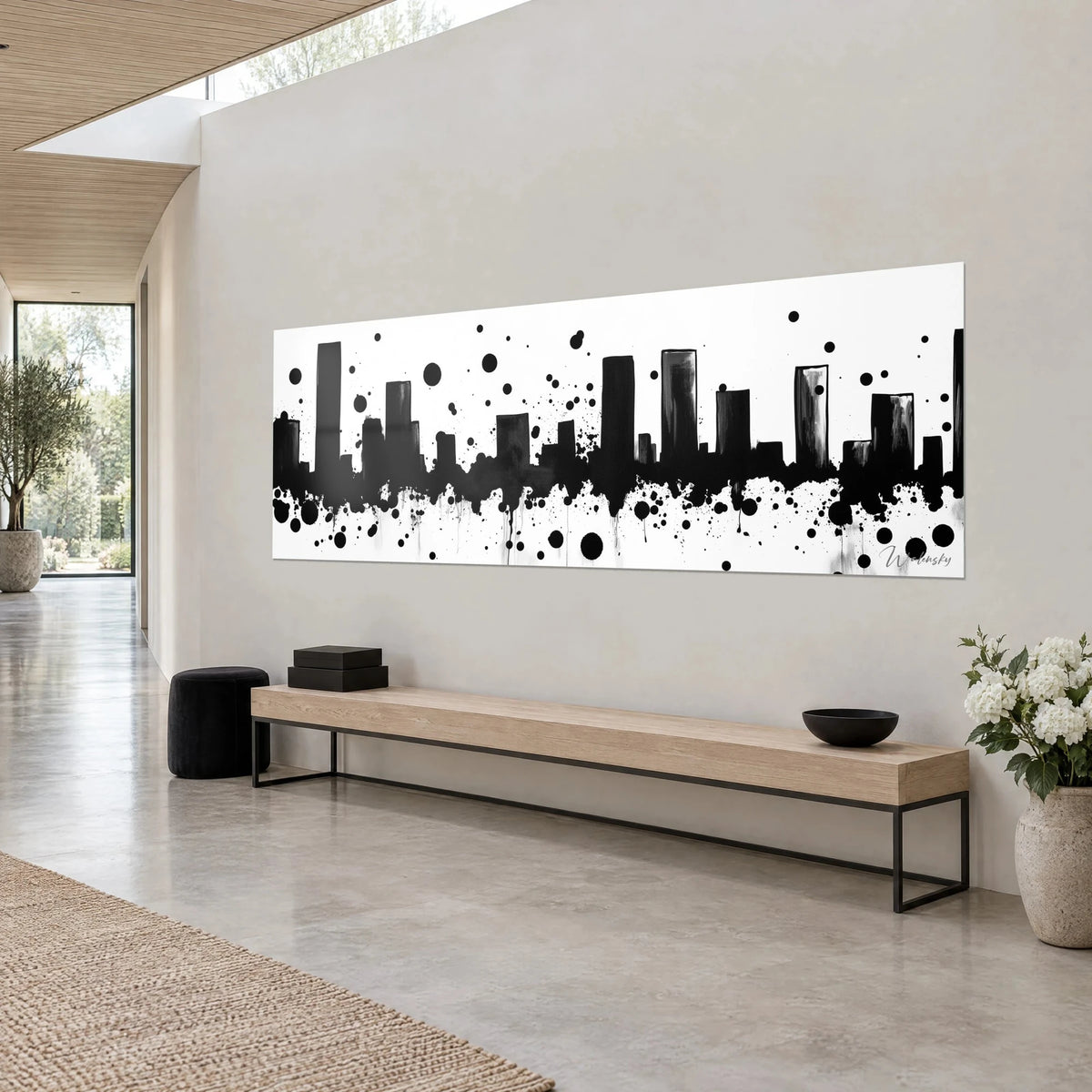 Wall art urban silhouette in black ink, grey drips and streaks on bright white, beige wall of an architect's home