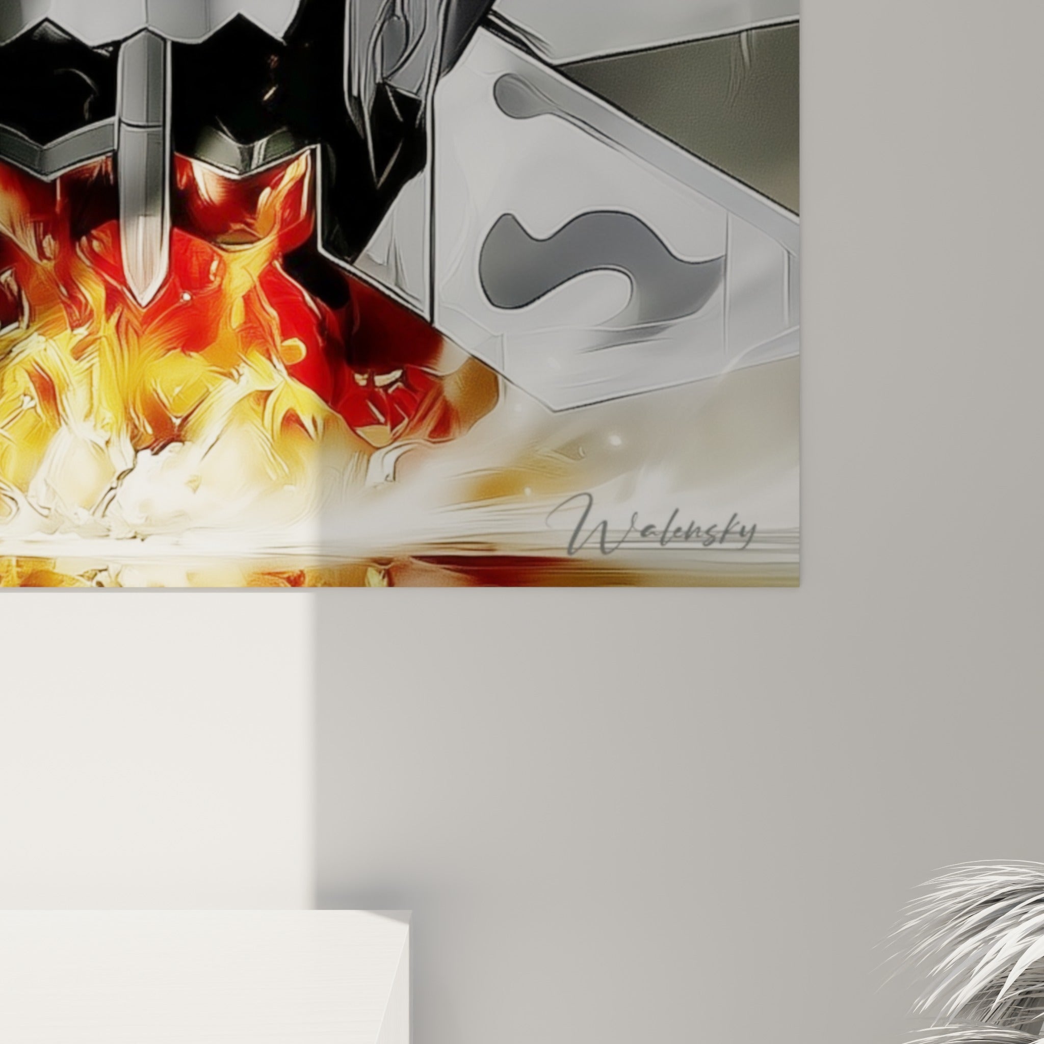 Détail des contours graphiques gris et de la traînée de feu orangée sur la toile accrochée