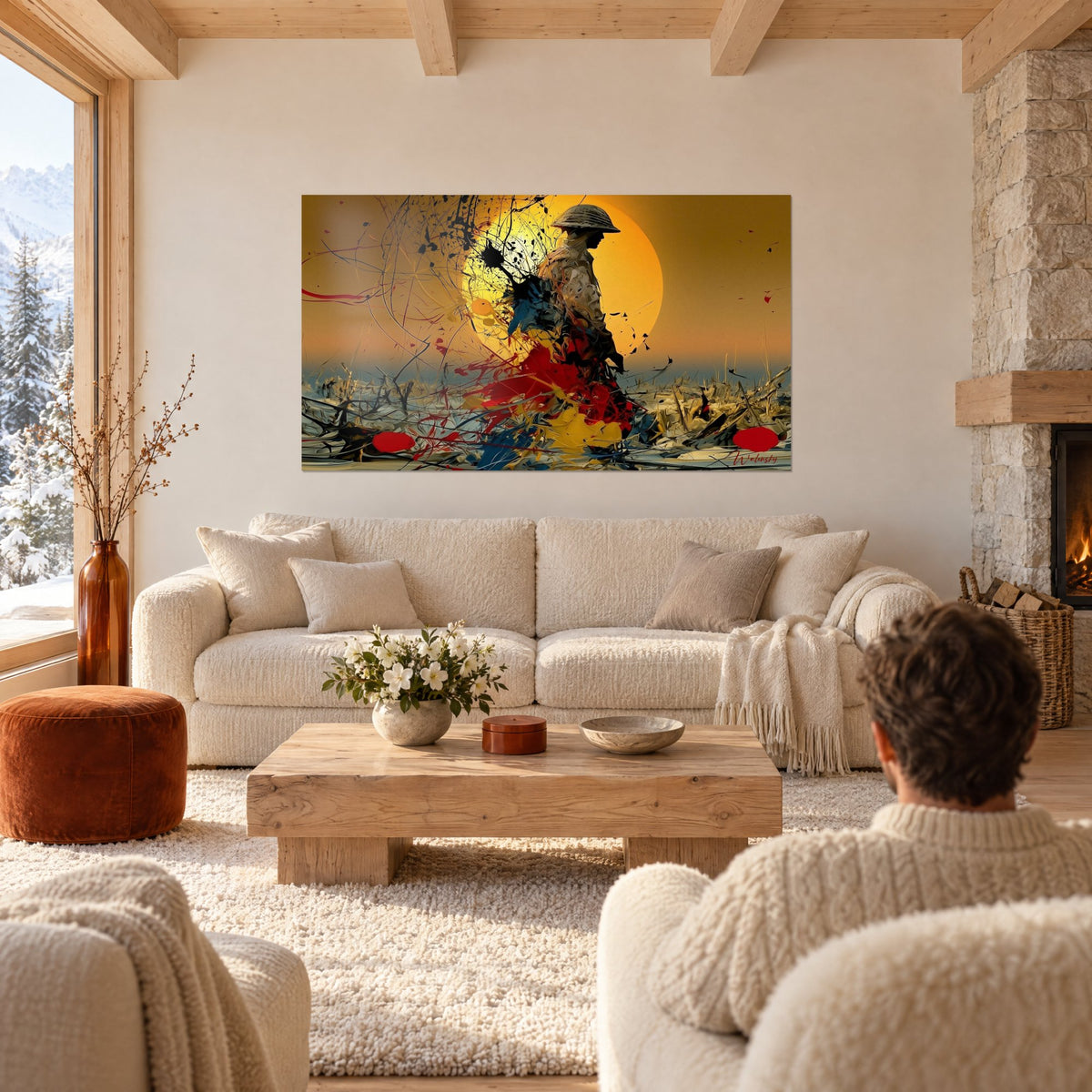 Tableau soldat casqué en silhouette devant un soleil orange, éclaboussures rouges et jaunes, au-dessus d'un canapé dans un salon lumineux