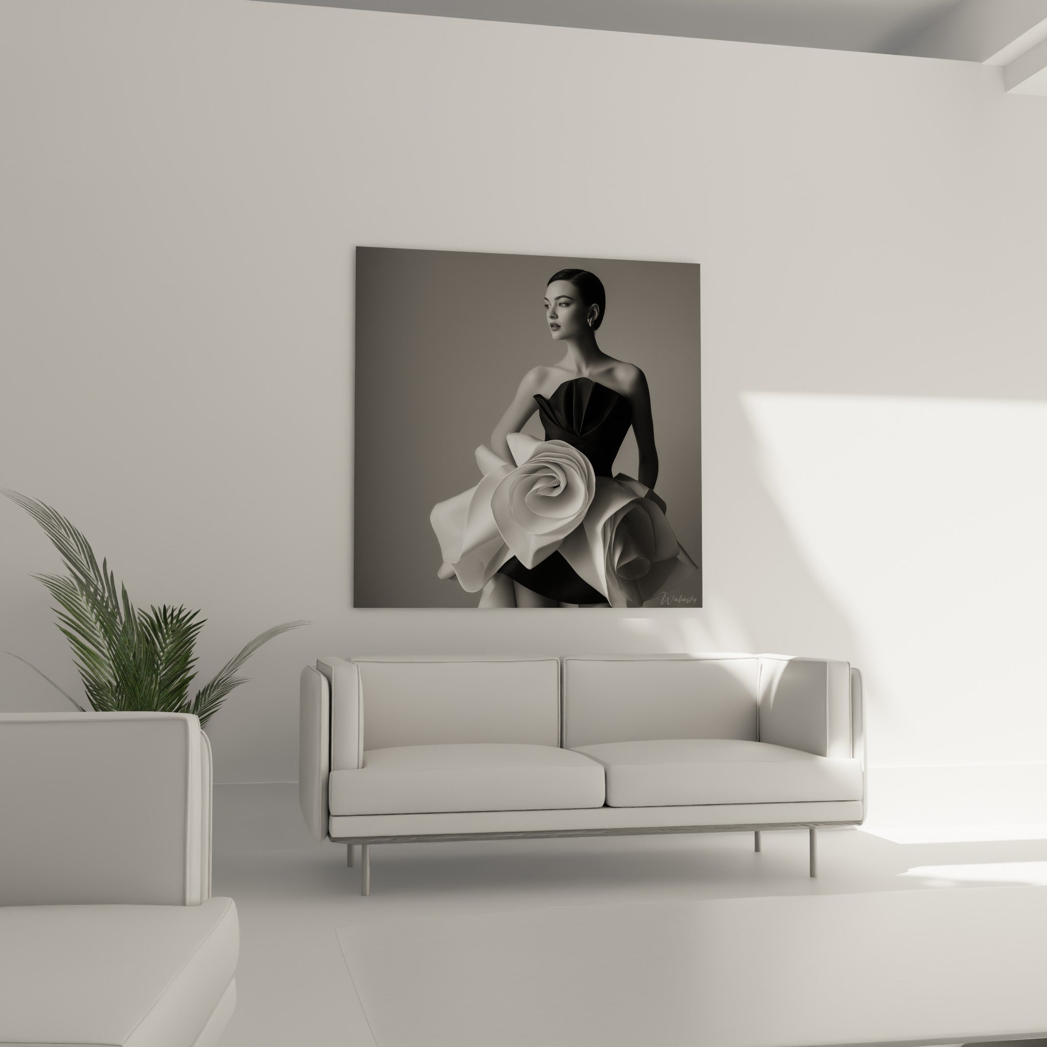 Jeune femme au chignon lisse dans une robe noire et blanche sculpturale, au-dessus d'un canapé dans un salon lumineux