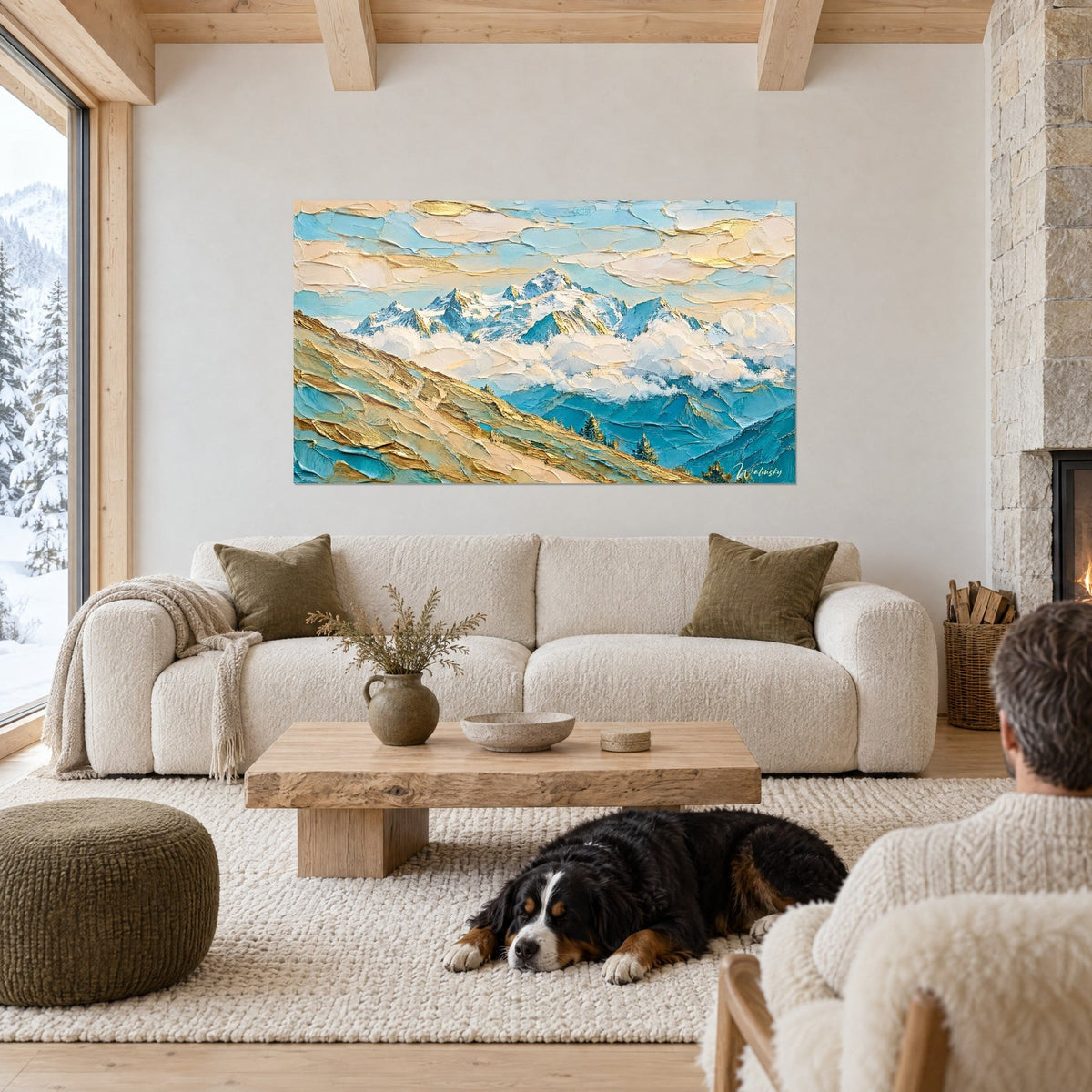 Wall art of a massive snowy mountain range with glacier-blue and cream ridges, golden slope in thick impasto, black dog lying down, above a sofa in a bright living room