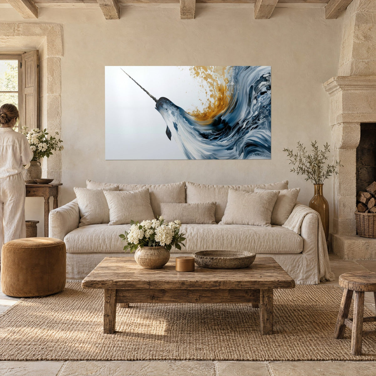 Wall art narwhal with twisted tusk in a midnight blue and white swirl, amber splash, above a sofa in a bright living room
