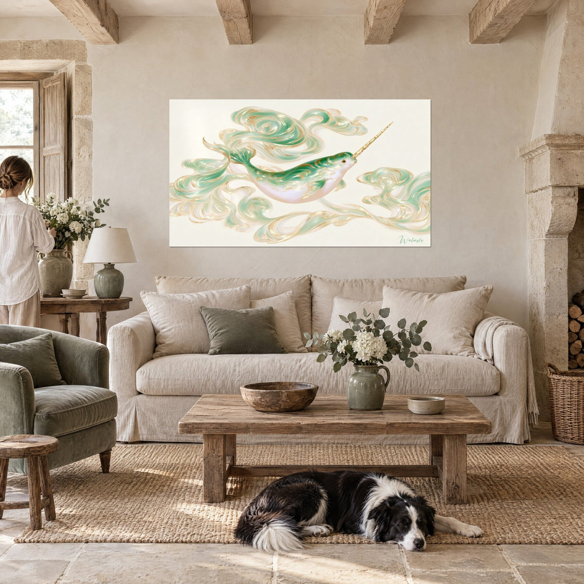Wall art of a narwhal in emerald with a golden tusk, swirls of ivory and gold, above a sofa in a bright living room