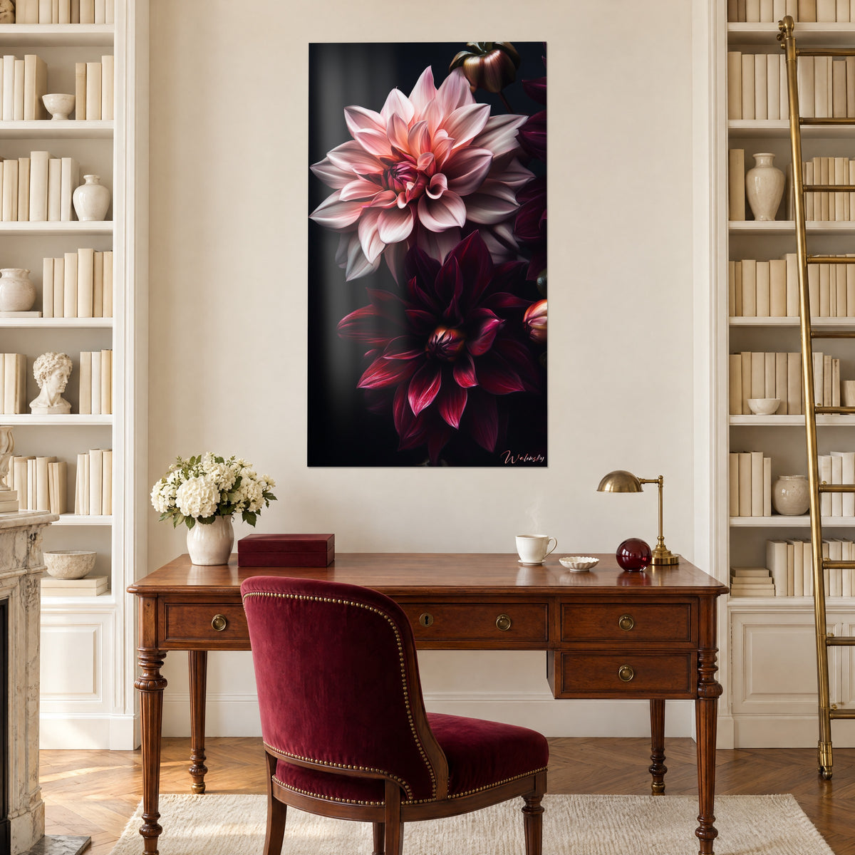 Floral wall art in tender pink and cherry red on an India ink black background, between two white bookshelves, above a wooden desk