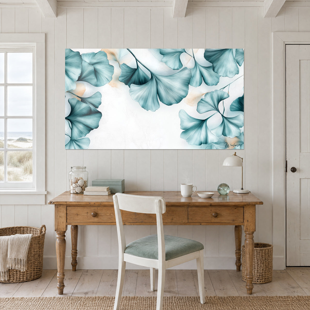 Wall art finely striped sea-green ginkgo fans with peach reflections, above a light wood desk