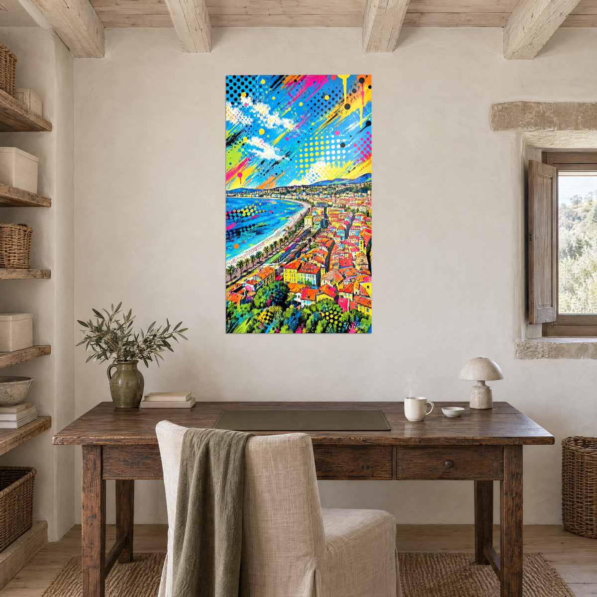 Wall art pop art coastal landscape, bluish hills, green palm trees and ochre buildings, above a wooden desk with a flower vase and lamp